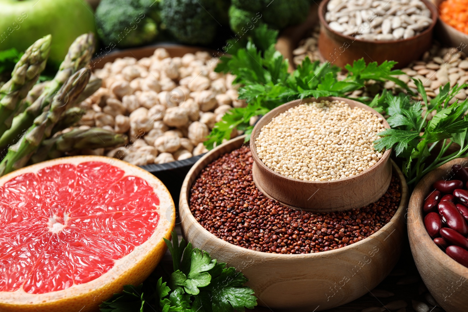 Fresh fruit, seeds and vegetables on table, closeup Photo of Fresh fruit, seeds and vegetables on table, closeup