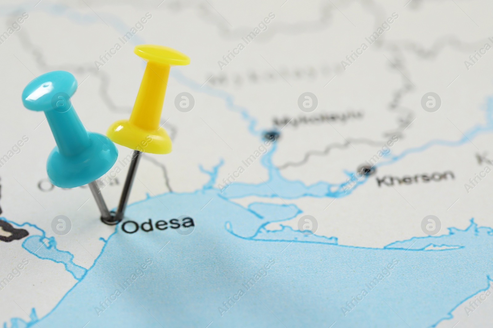 MYKOLAIV, UKRAINE - NOVEMBER 09, 2020: Odesa city marked with push pins on contour map of Ukraine, closeup Photo of MYKOLAIV, UKRAINE - NOVEMBER 09, 2020: Odesa city marked with push pins on contour map of Ukraine, closeup