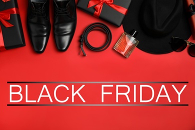 Flat lay composition with gift boxes, male accessories and phrase Black Friday on red background Photo of Flat lay composition with gift boxes, male accessories and phrase Black Friday on red background