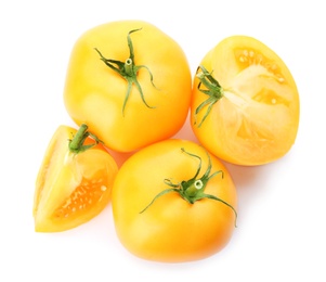 Cut ripe yellow tomatoes isolated on white, top view Photo of Cut ripe yellow tomatoes isolated on white, top view
