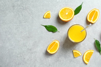 Glass of orange juice and fresh fruits on table, top view Photo of Glass of orange juice and fresh fruits on table, top view