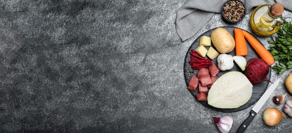 Ingredients for traditional borscht on grey table, flat lay. Space for text Photo of Ingredients for traditional borscht on grey table, flat lay. Space for text