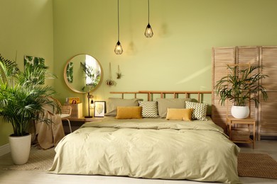 Stylish bedroom with modern furniture. Interior design Photo of Stylish bedroom with modern furniture. Interior design