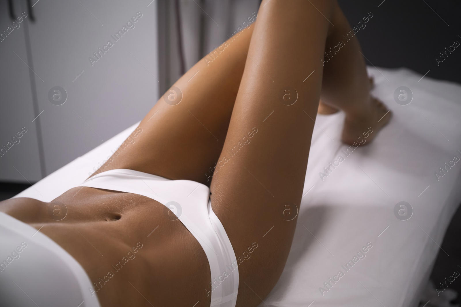 Young woman showing smooth silky skin after sugaring procedure in salon, closeup Photo of Young woman showing smooth silky skin after sugaring procedure in salon, closeup