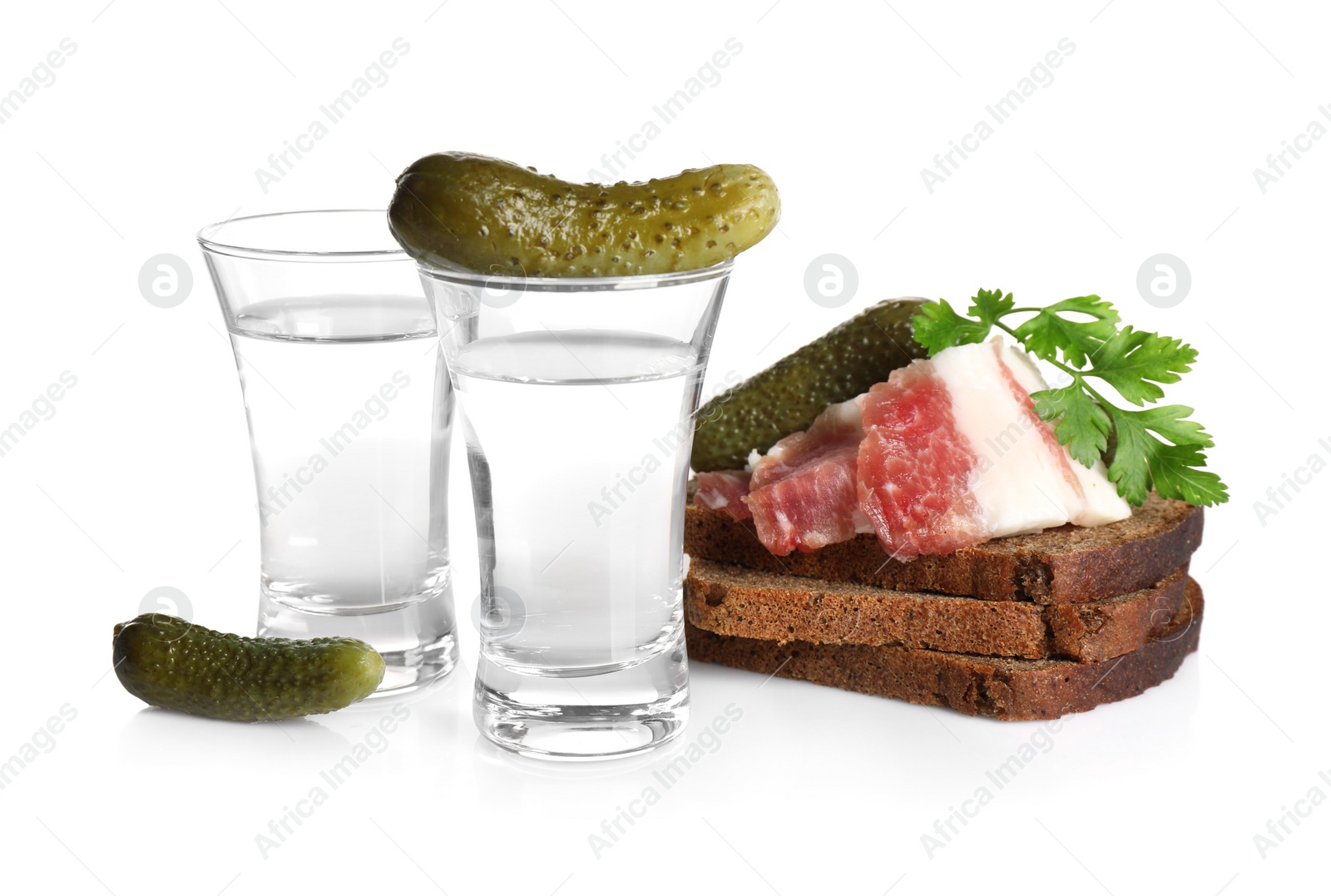 Russian vodka and different appetizers isolated on white Photo of Russian vodka and different appetizers isolated on white