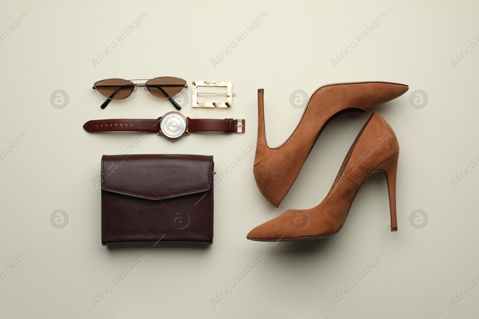 Stylish woman's bag, shoes and accessories on light background, flat lay Photo of Stylish woman's bag, shoes and accessories on light background, flat lay