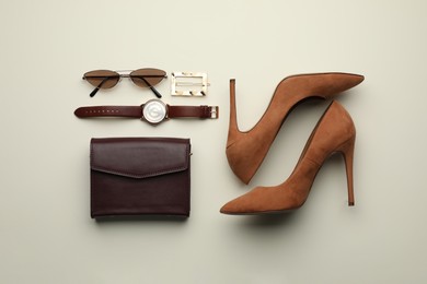 Stylish woman's bag, shoes and accessories on light background, flat lay Photo of Stylish woman's bag, shoes and accessories on light background, flat lay