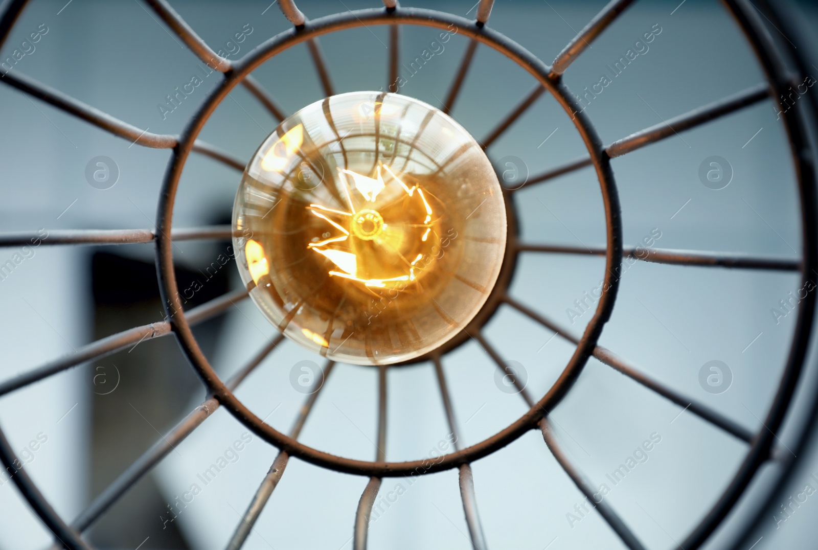 Stylish metallic pendant lamp with Edison light bulb indoors, bottom view Image of Stylish metallic pendant lamp with Edison light bulb indoors, bottom view