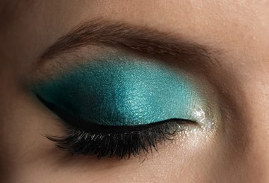 Young woman with evening makeup, closeup. Eye shadow product Photo of Young woman with evening makeup, closeup. Eye shadow product