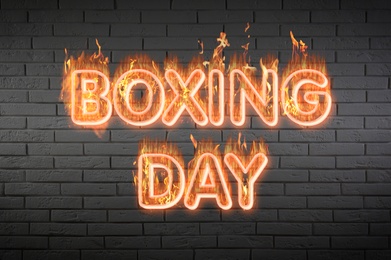 Flaming text Boxing Day against brick wall Image of Flaming text Boxing Day against brick wall