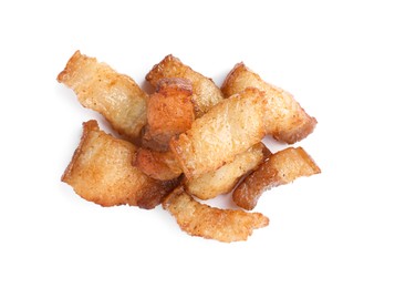 Tasty fried cracklings on white background, top view. Cooked pork lard Photo of Tasty fried cracklings on white background, top view. Cooked pork lard