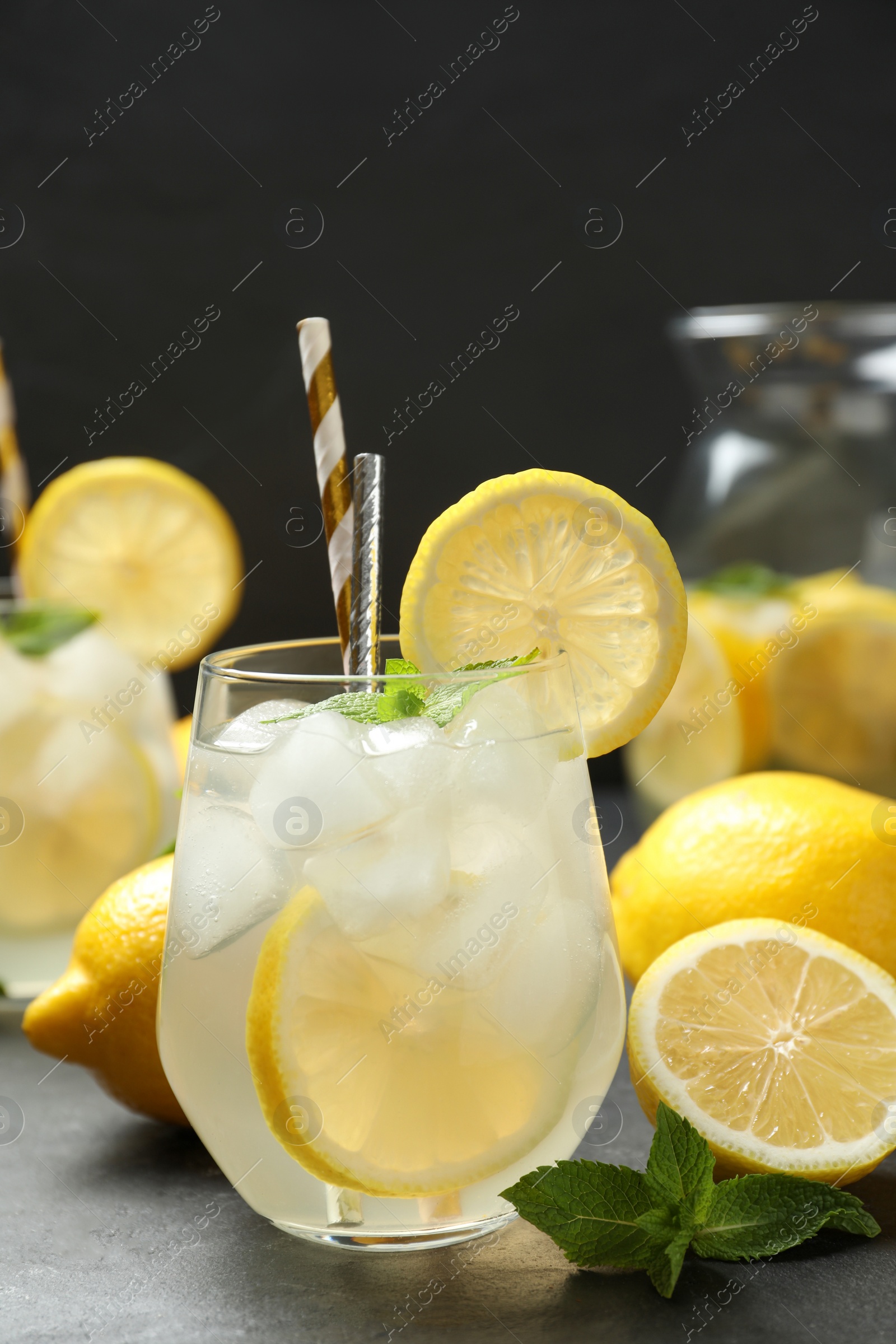 Natural lemonade with mint on grey table. Summer refreshing drink Photo of Natural lemonade with mint on grey table. Summer refreshing drink