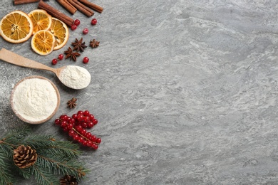 Flat lay composition with Christmas decor and flour on grey table. Space for text Photo of Flat lay composition with Christmas decor and flour on grey table. Space for text