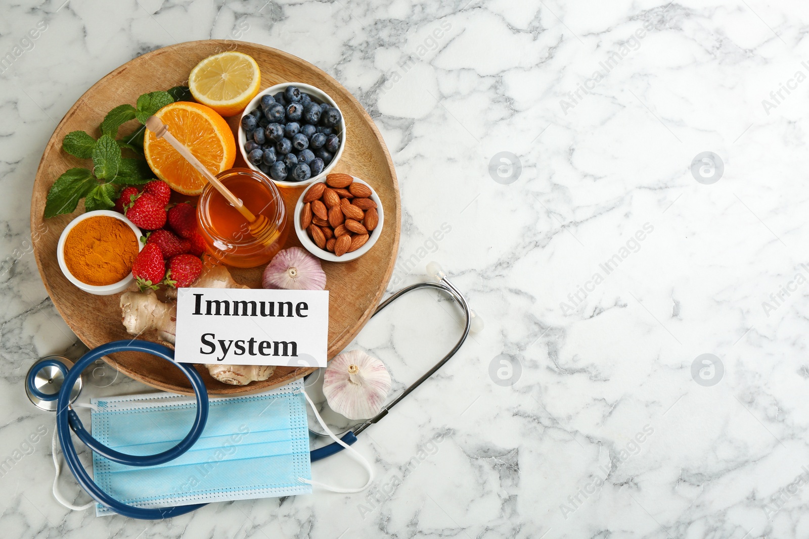 Card with phrase Immune System, medical items and fresh products on light marble table, flat lay. Space for text Photo of Card with phrase Immune System, medical items and fresh products on light marble table, flat lay. Space for text