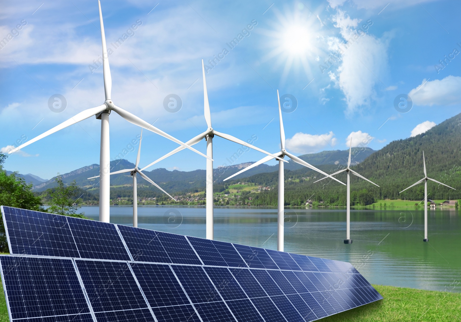 Alternative energy sources. Wind turbines installed in water near bank with solar panels Image of Alternative energy sources. Wind turbines installed in water near bank with solar panels