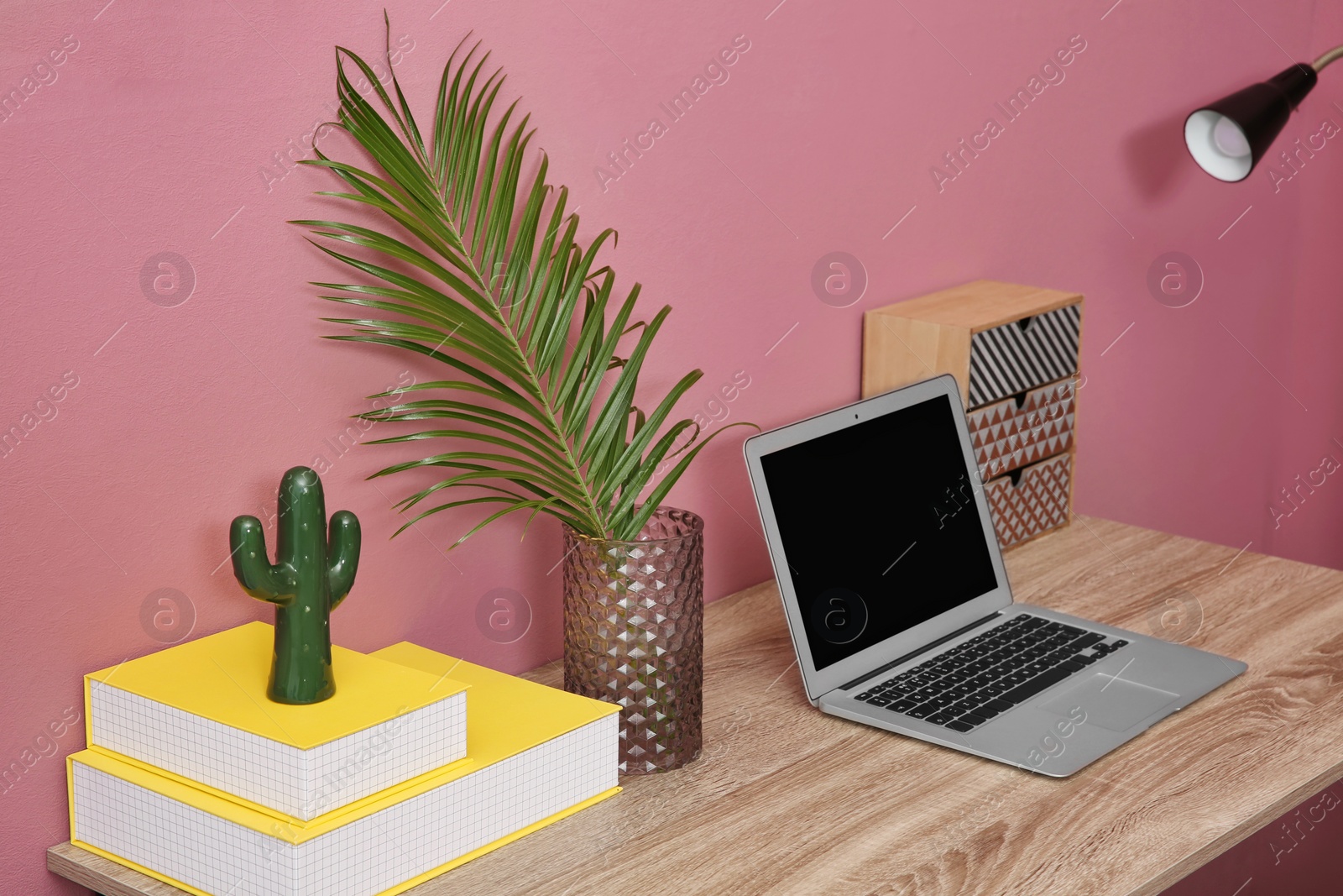 Modern stylish room interior with tropical leaf in glass vase Photo of Modern stylish room interior with tropical leaf in glass vase