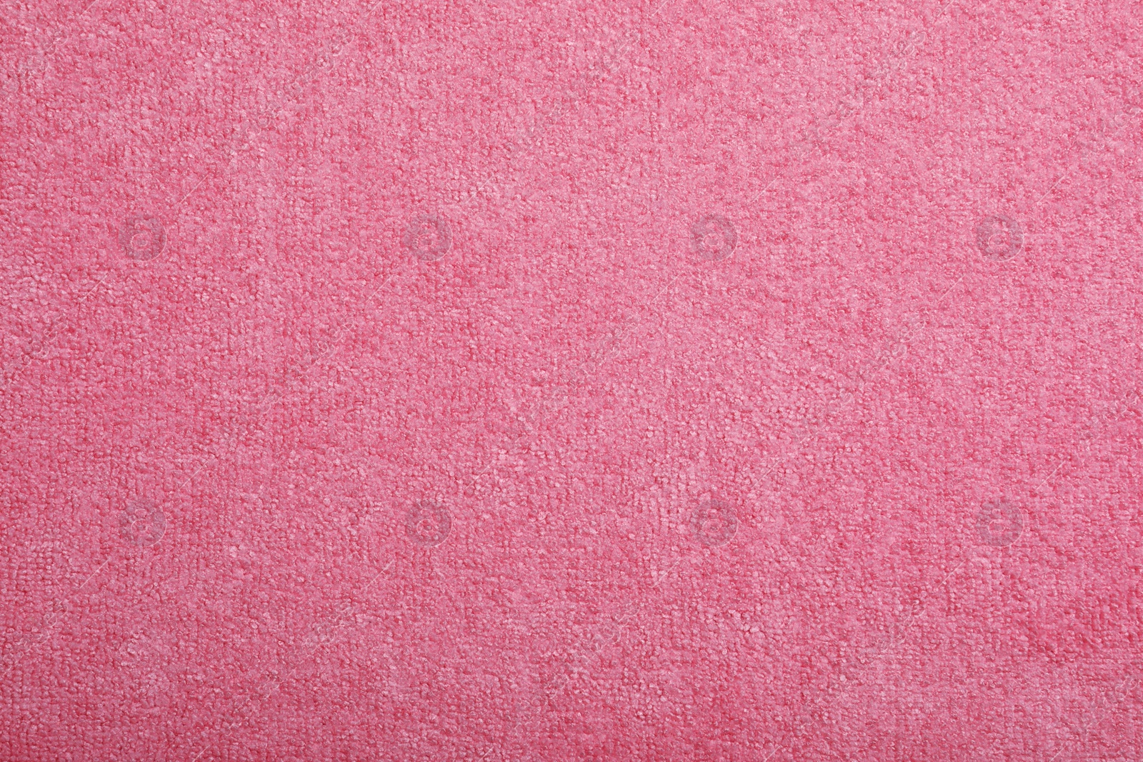 Pink microfiber cloth as background, top view Photo of Pink microfiber cloth as background, top view