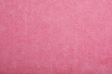 Pink microfiber cloth as background, top view Photo of Pink microfiber cloth as background, top view