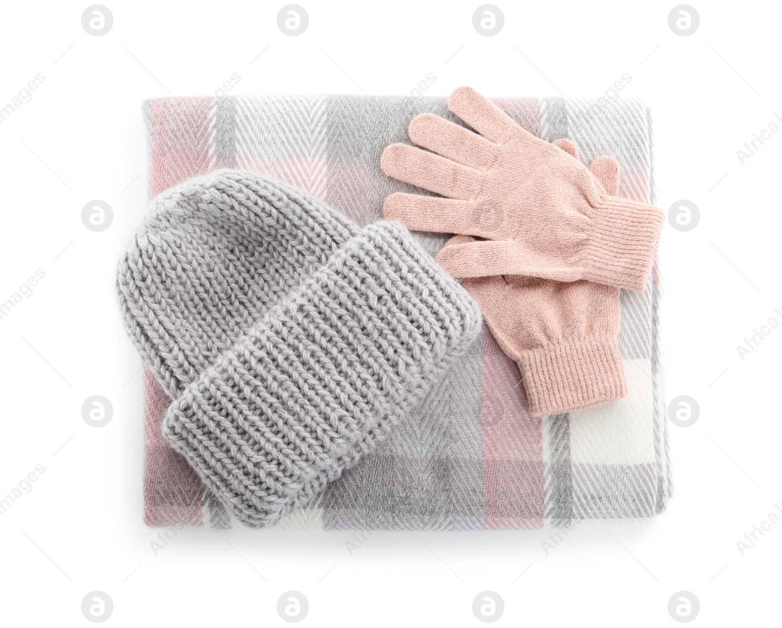 Photo of Woolen gloves, scarf and hat on white background, top view