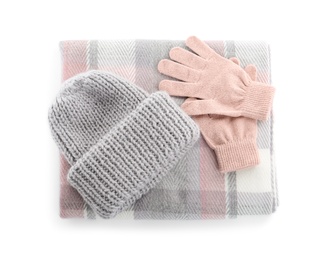 Woolen gloves, scarf and hat on white background, top view Photo of Woolen gloves, scarf and hat on white background, top view