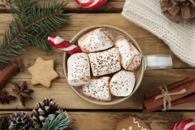 Flat lay composition with delicious marshmallow cocoa and Christmas decor on wooden table Photo of Flat lay composition with delicious marshmallow cocoa and Christmas decor on wooden table