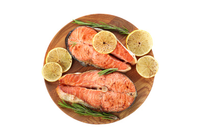 Wooden plate with tasty cooked red fish isolated on white, top view Photo of Wooden plate with tasty cooked red fish isolated on white, top view