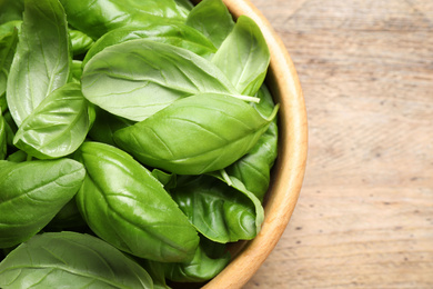 Fresh basil on wooden table, top view Photo of Fresh basil on wooden table, top view