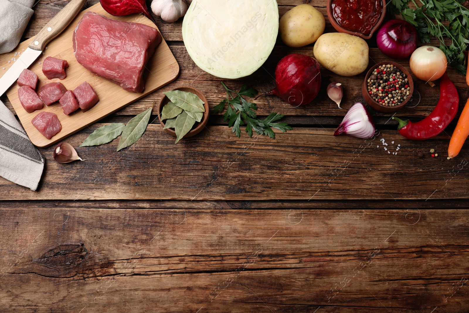Fresh borscht ingredients on wooden table, flat lay. Space for text Photo of Fresh borscht ingredients on wooden table, flat lay. Space for text