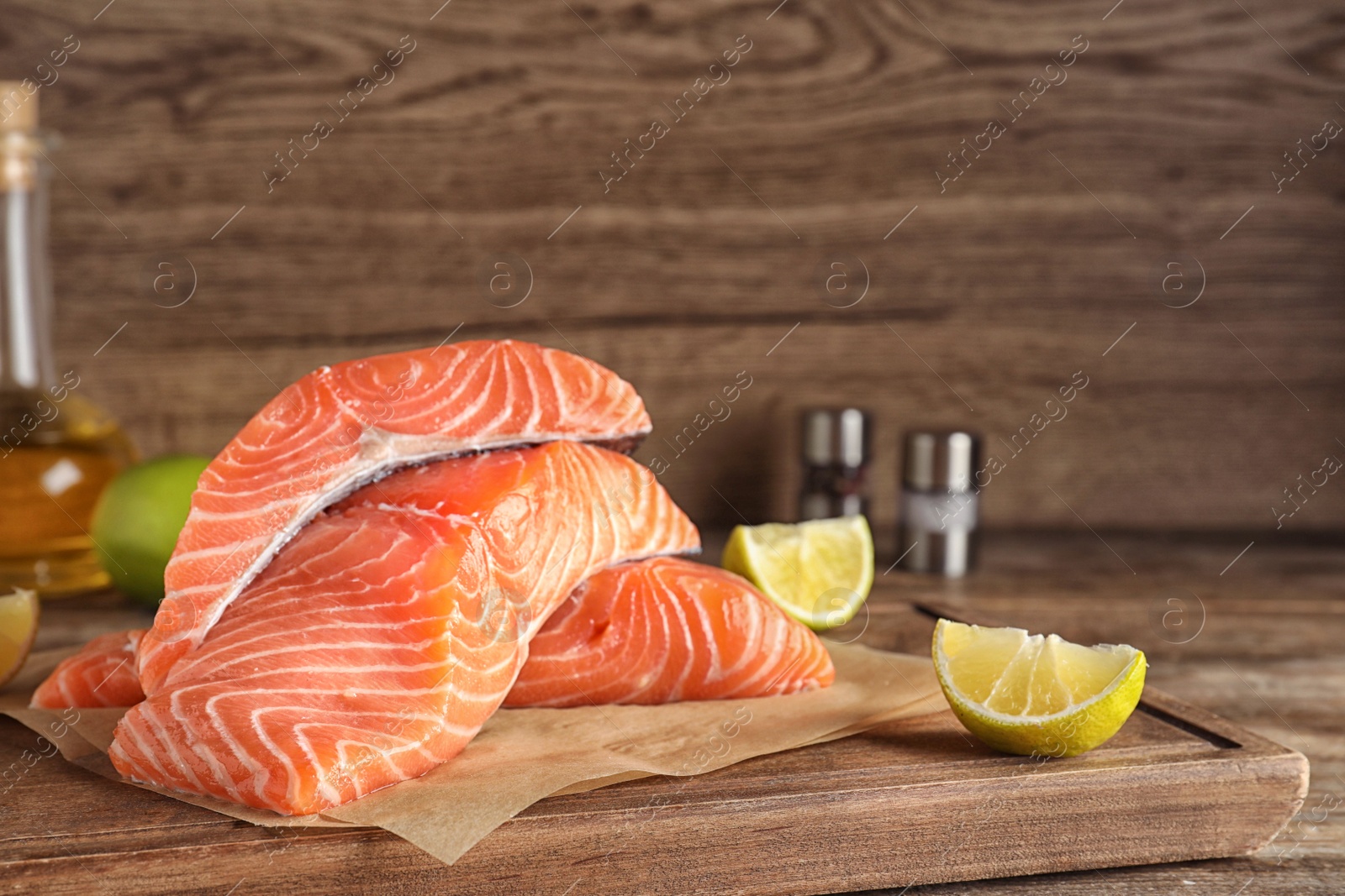 Photo of Fresh raw salmon on wooden board. Fish delicacy