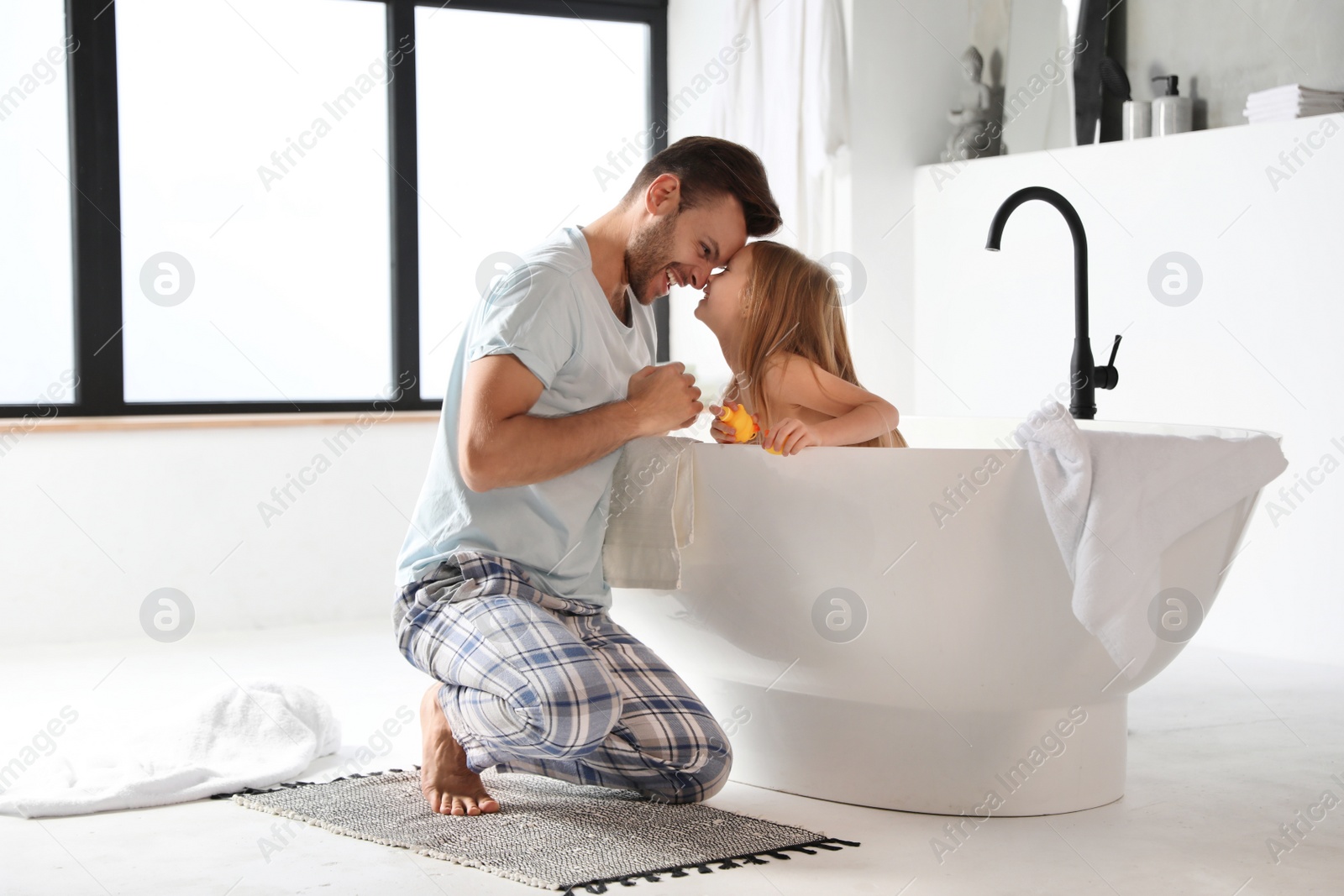 Father and his cute little daughter in bathroom Photo of Father and his cute little daughter in bathroom