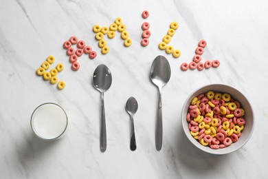 Word Family, cereal rings, milk and different spoons on white marble table, flat lay Photo of Word Family, cereal rings, milk and different spoons on white marble table, flat lay