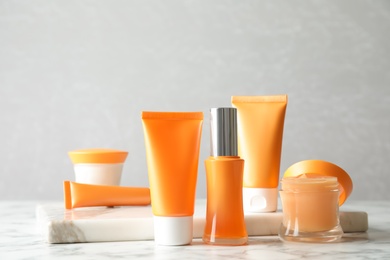 Set of luxury cosmetic products on white marble table Photo of Set of luxury cosmetic products on white marble table