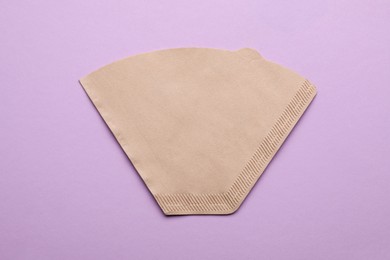 Paper coffee filter on lilac background, top view Photo of Paper coffee filter on lilac background, top view