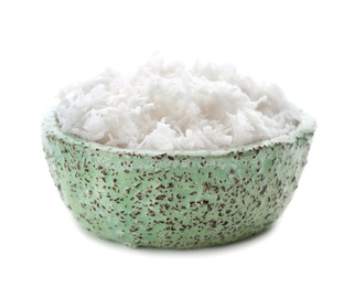 Fresh coconut flakes in bowl on white background Photo of Fresh coconut flakes in bowl on white background