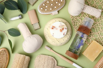 Eco friendly personal care products on light green background, flat lay Photo of Eco friendly personal care products on light green background, flat lay