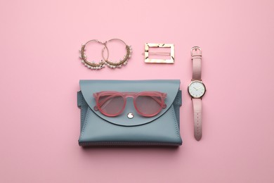 Stylish woman's bag and accessories on pink background, flat lay Photo of Stylish woman's bag and accessories on pink background, flat lay