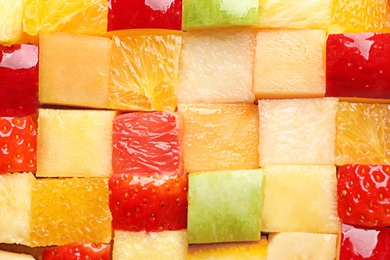 Fresh cut fruits as background Photo of Fresh cut fruits as background