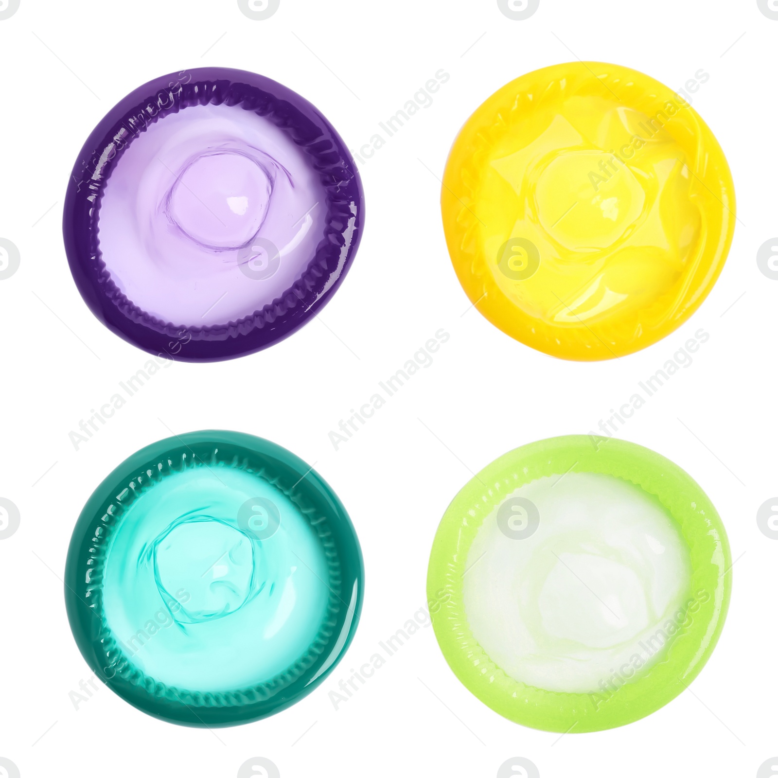 Set with different unpacked condoms on white background, top view Image of Set with different unpacked condoms on white background, top view