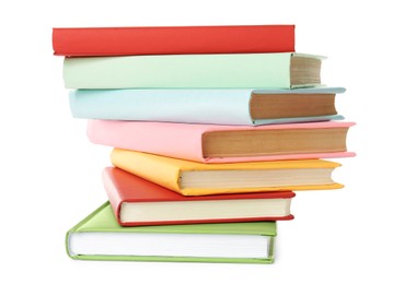 Many colorful hardcover books on white background Photo of Many colorful hardcover books on white background