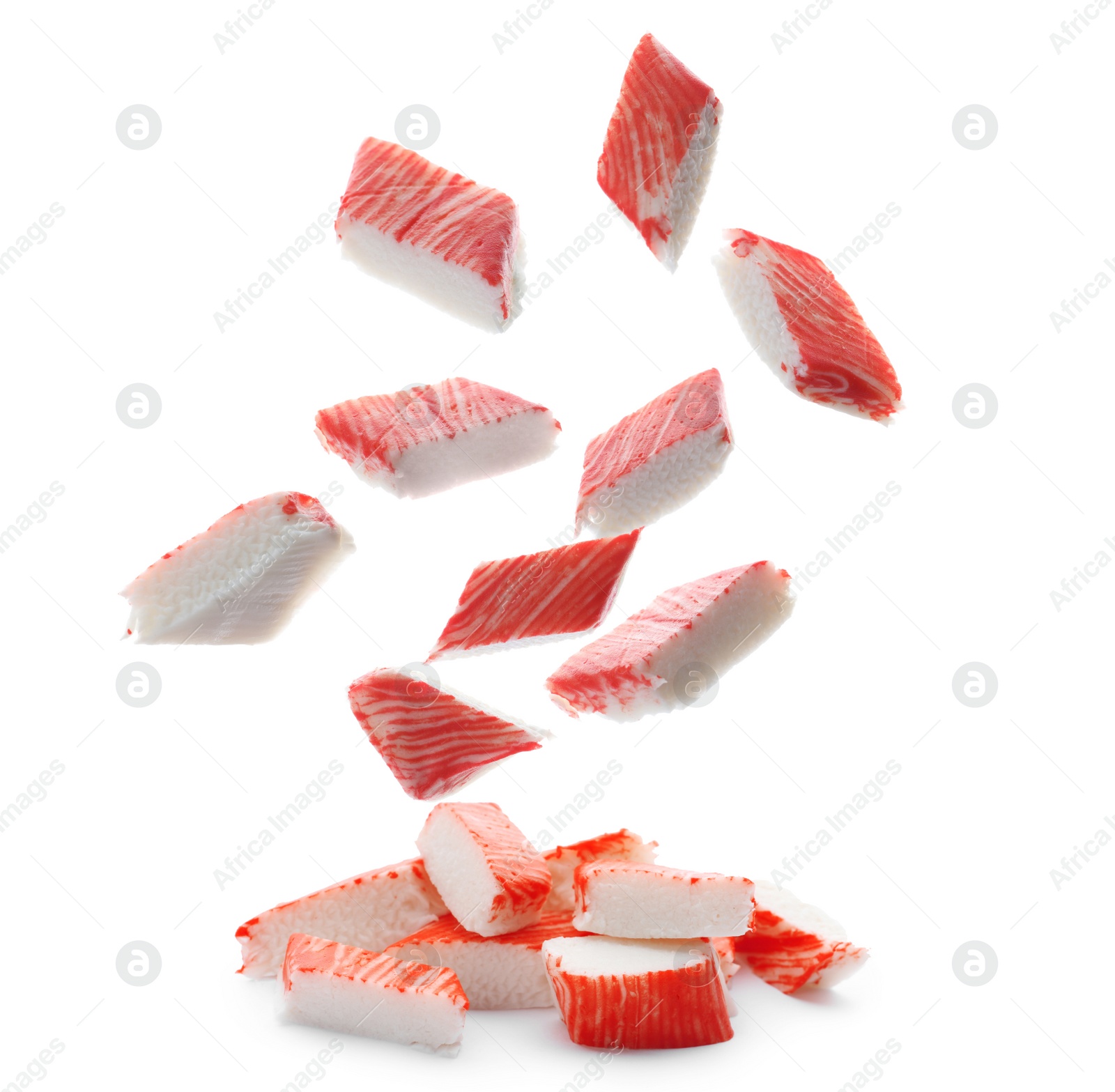 Cut fresh crab sticks falling on white background Image of Cut fresh crab sticks falling on white background