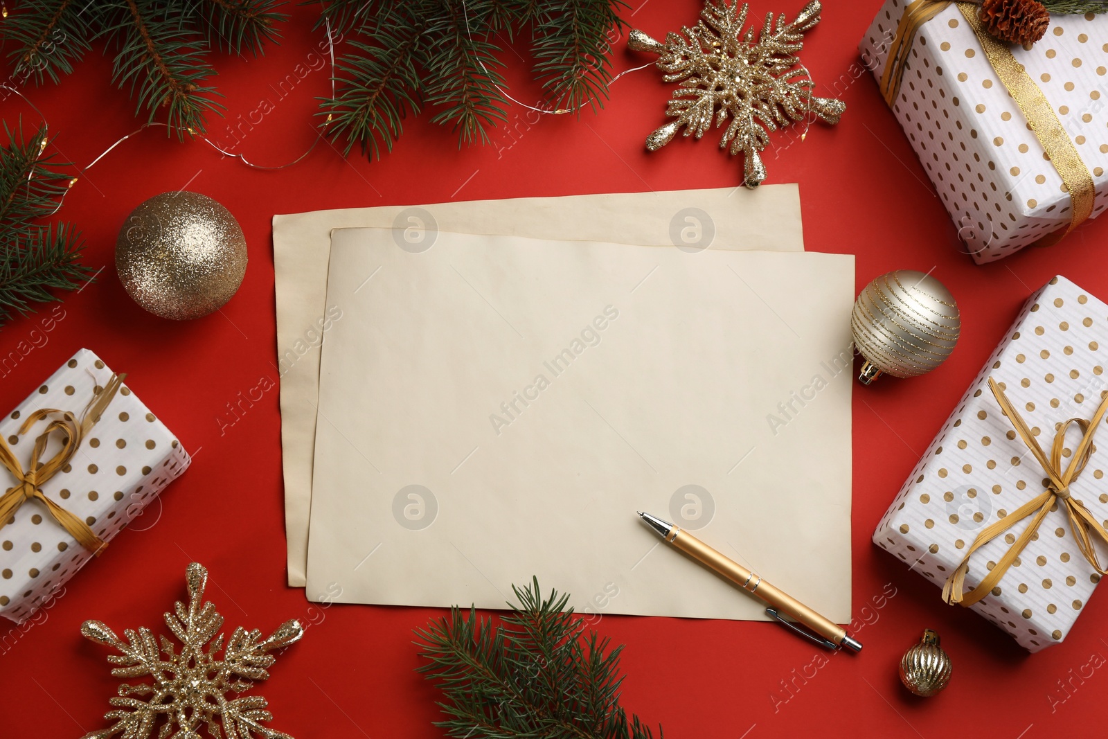 Flat lay composition with blank sheets of paper on red background, space for text. Writing letter to Santa Photo of Flat lay composition with blank sheets of paper on red background, space for text. Writing letter to Santa