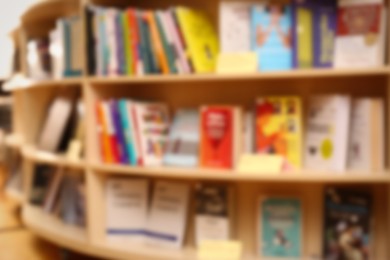 Blurred view of books on shelves in library Photo of Blurred view of books on shelves in library