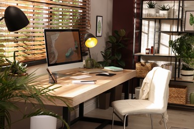Photo of Light room interior with comfortable workplace near window