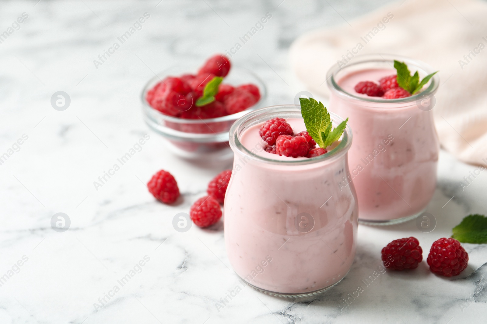 Yummy raspberry smoothie on white marble table Image of Yummy raspberry smoothie on white marble table