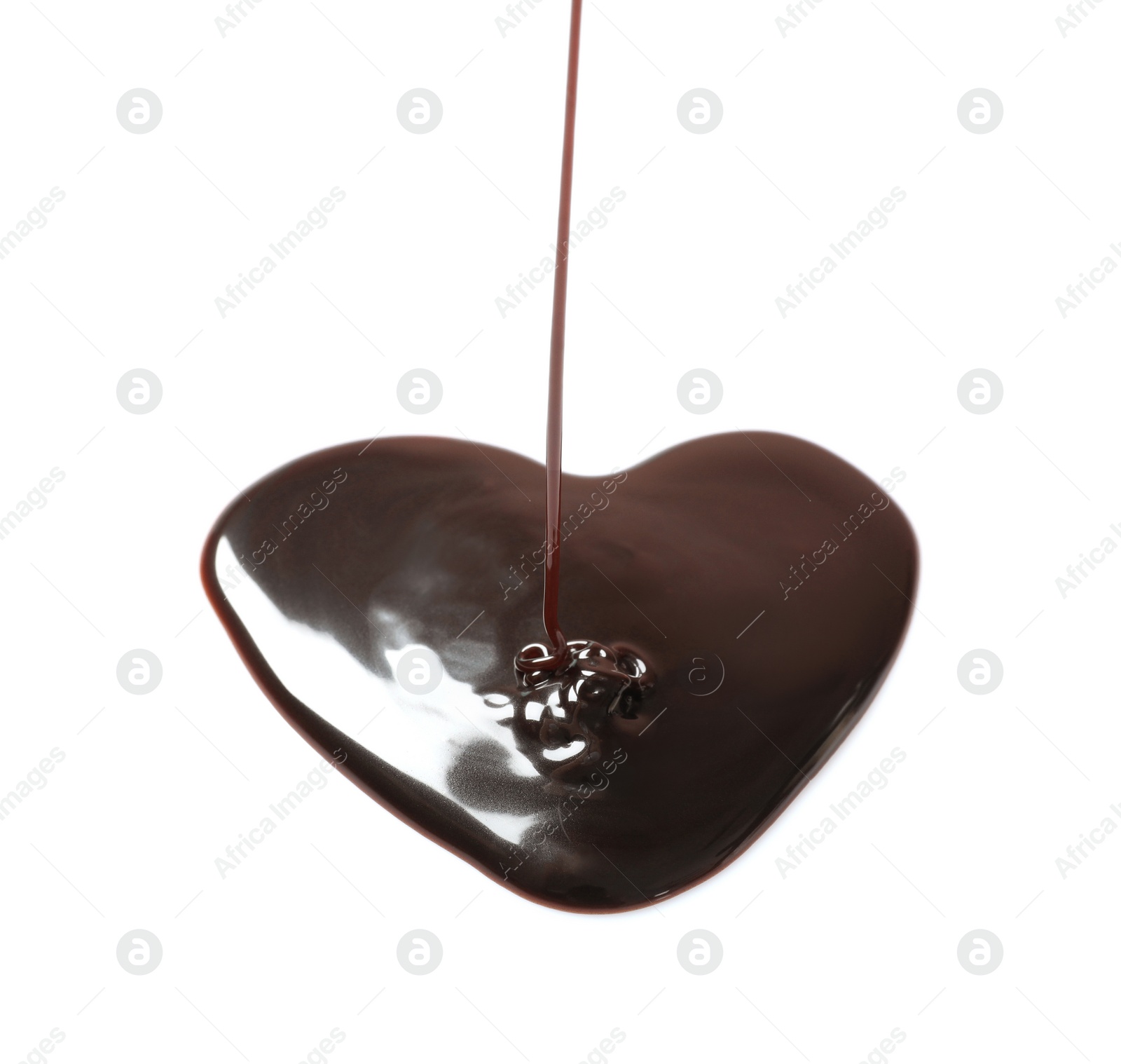 Pouring chocolate syrup into heart shaped puddle on white background Photo of Pouring chocolate syrup into heart shaped puddle on white background