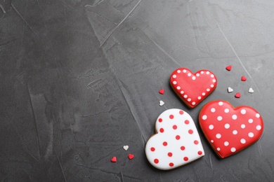 Valentine's day cookies on grey table, flat lay. Space for text Photo of Valentine's day cookies on grey table, flat lay. Space for text