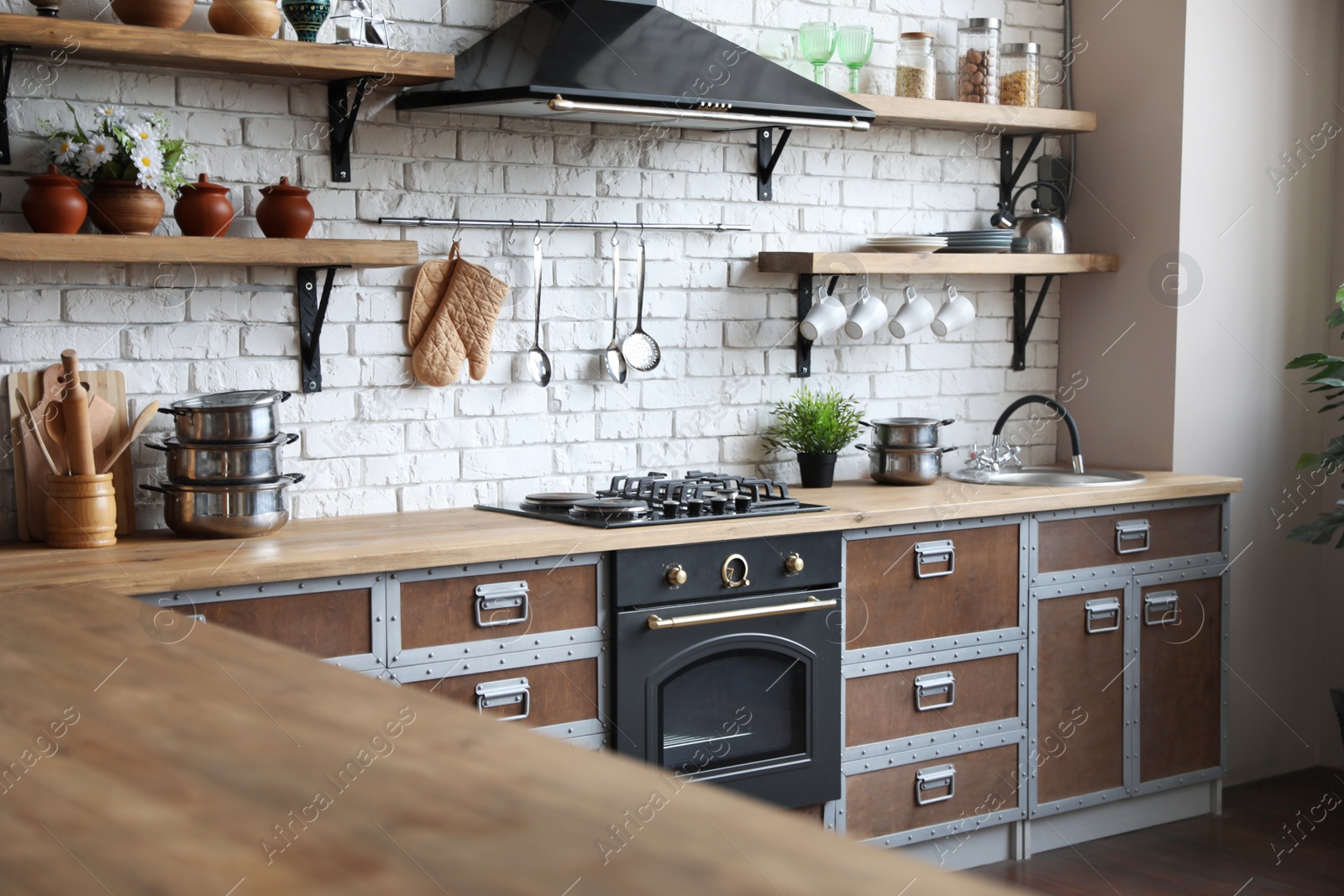 Photo of Beautiful kitchen interior with new stylish furniture