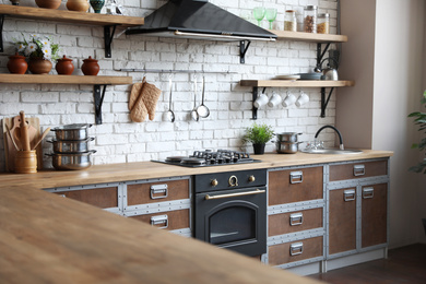 Photo of Beautiful kitchen interior with new stylish furniture
