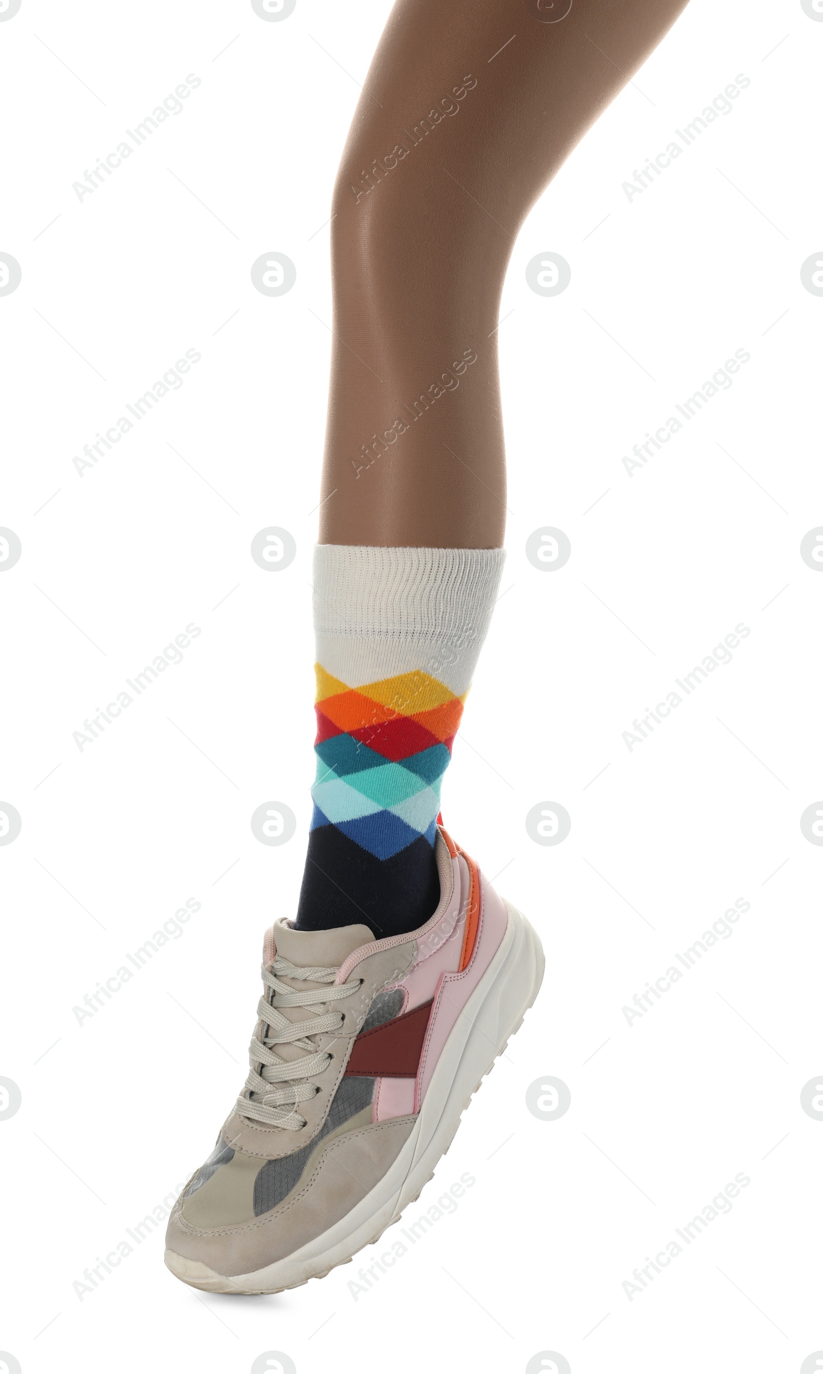 Photo of Woman wearing sneakers on white background, closeup