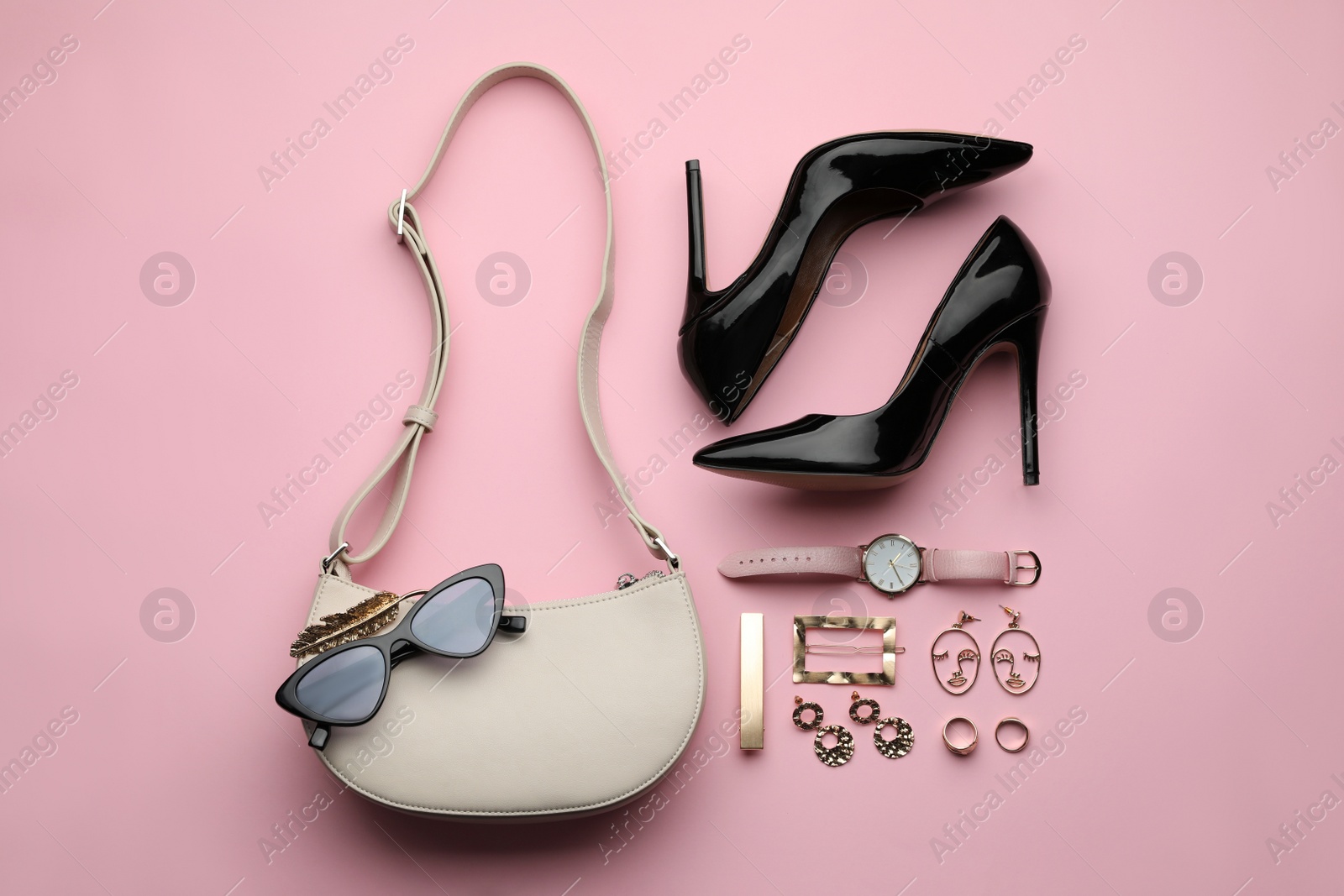 Stylish woman's bag, shoes and accessories on beige background, flat lay Photo of Stylish woman's bag, shoes and accessories on beige background, flat lay